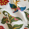 The Gujarat custom&nbsp;fabric is a gorgeous embroidery with brilliant colors by Clarence House available on Dixie & Grace